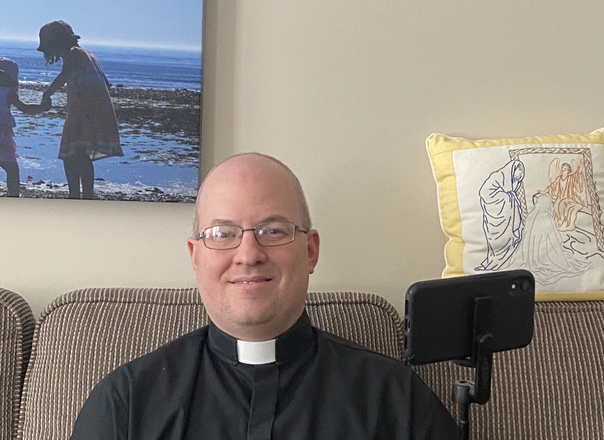 Tom Vaughn prepares to livestream from home to the people of St. David’s Welland.