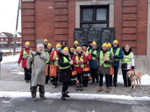 Walkers gathered outside 541 Eatery and Exchange